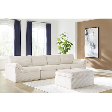 CANEFIELD 4-PC SECTIONAL WITH OTTOMAN