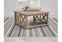 elmferd light brown cocktail table   